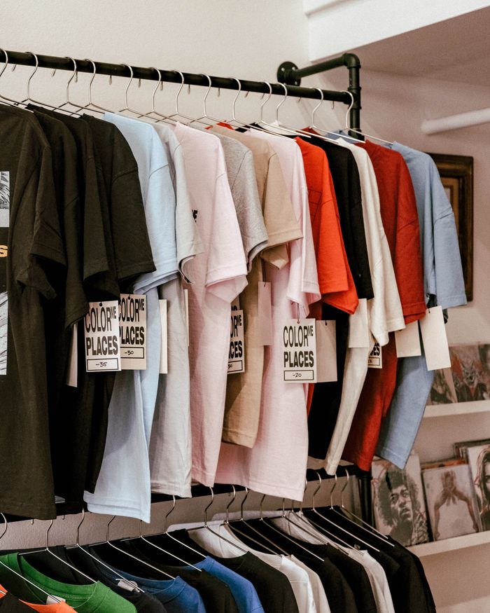 hero-img-01 Vibrant arrangement of colored t-shirts in an Orlando boutique. Perfect retail stock image.