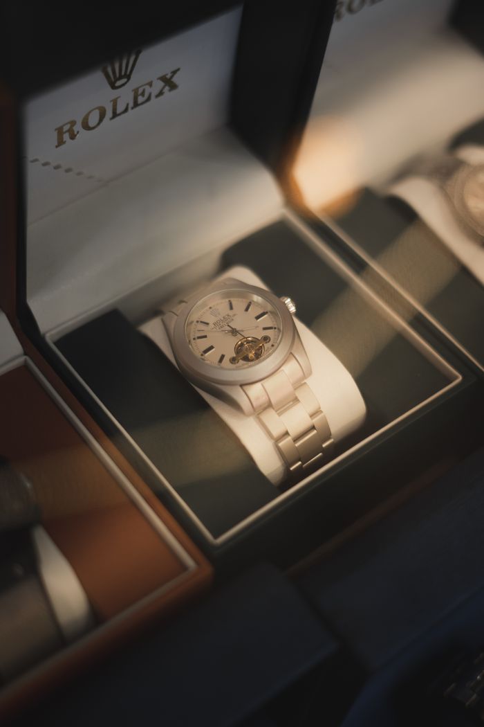 gallery-3 Close-up of a luxurious Rolex watch on display in a store cabinet.