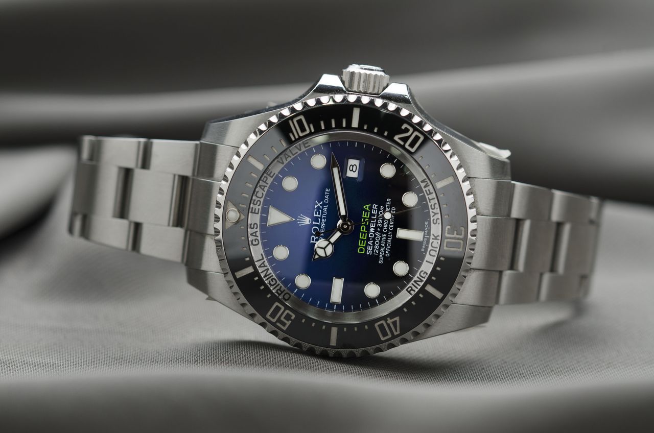 contact-img High-end Rolex wristwatch showcasing precision engineering and luxury design.